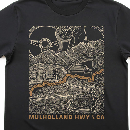 A black short-sleeve crewneck t-shirt featuring a detailed graphic print of Mulholland Highway in California. The graphic is rendered in a beige line-art style showing a vintage car, mountains, a building, and a gear shift pattern, with the text 'MULHOLLAND HWY (CA)' printed in beige at the bottom.